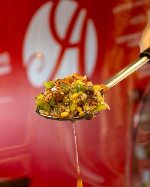 Amir food photography showing a sandwich and toppings.